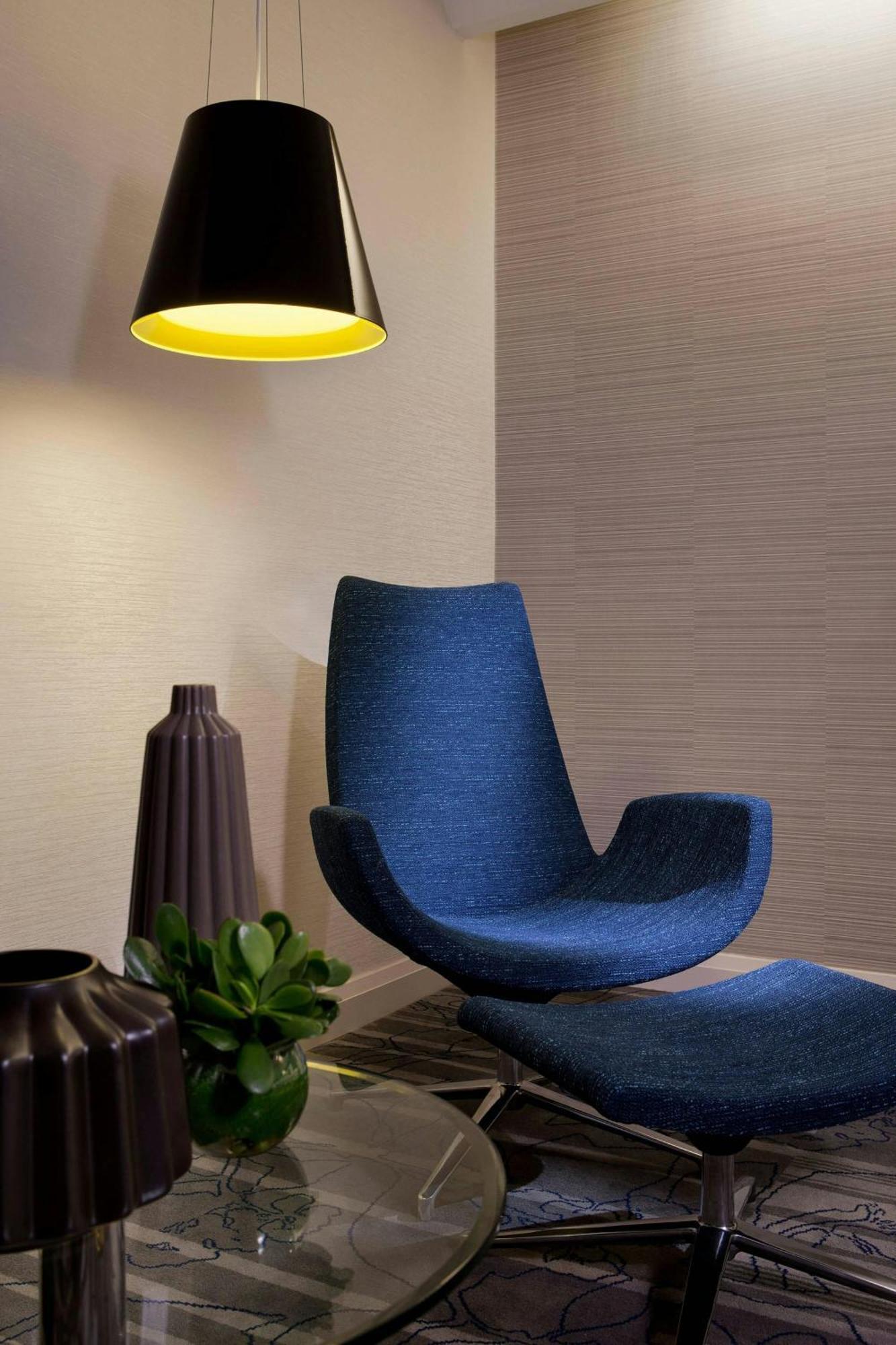 Sydney Harbour Marriott Hotel At Circular Quay Exterior photo A chair with a blue cushion